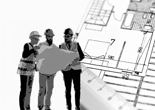 Drei Architekten mit Bauplan in der Hand
